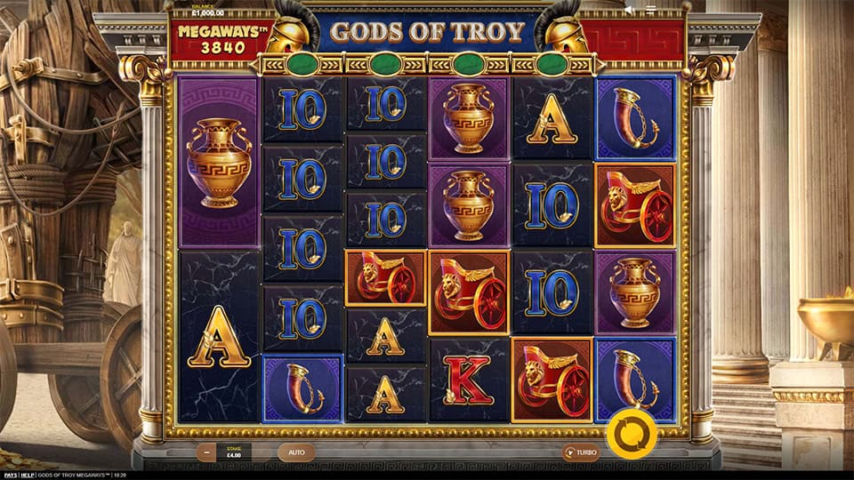 Gameplay screen showing Gods of Troy Megaways reels with helmets, amphoras and classic card symbols.