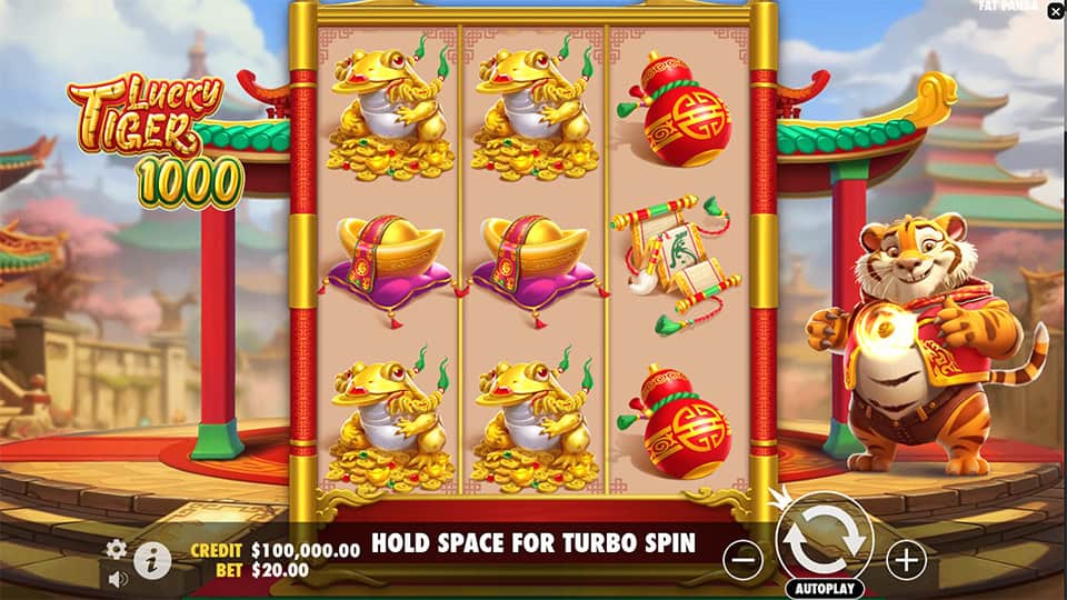 Base game screen of Lucky Tiger 1000 with golden frog, lantern and ingot symbols on a bright red and gold slot grid.
