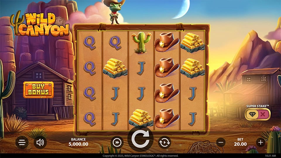 Wild Canyon base game screen with desert-themed symbols like gold bars, cowboy hats and cacti on parchment reels.