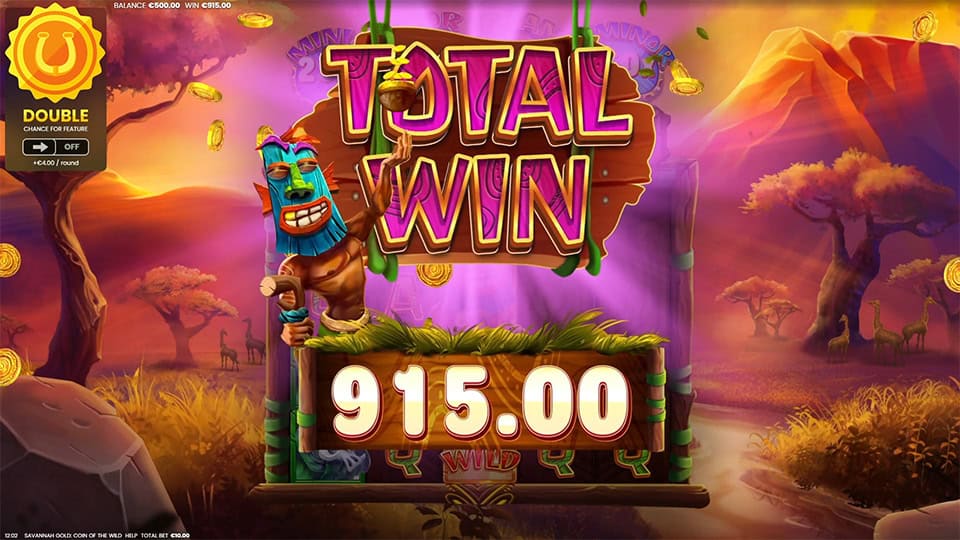 "Total Win" screen with 915.00 payout, gold coins flying and a tribal character celebrating against a reel background.