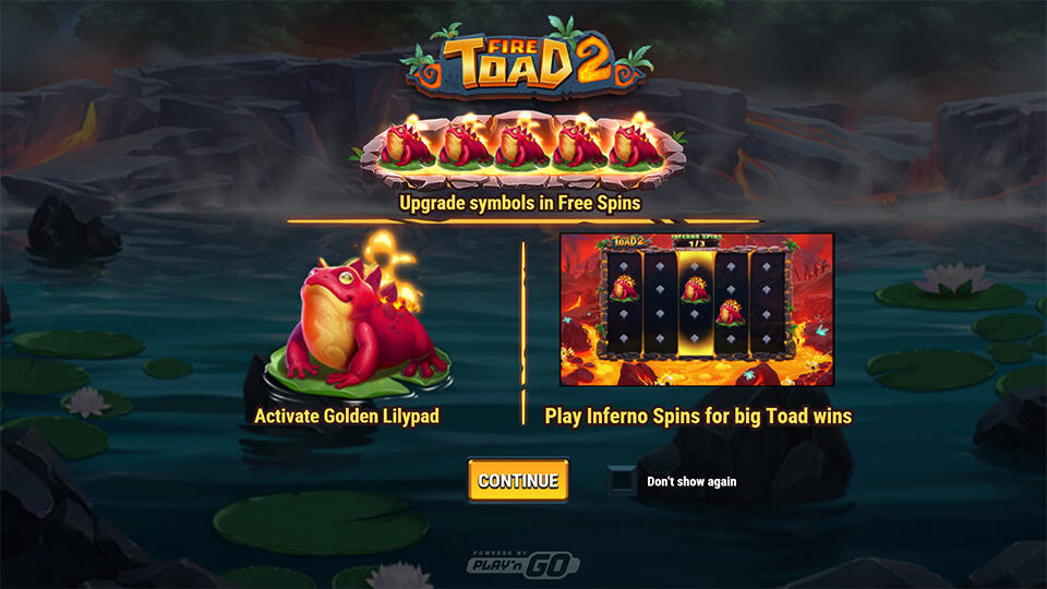 Start screen displaying various toad symbols and elemental icons on reels over a fiery jungle lake.