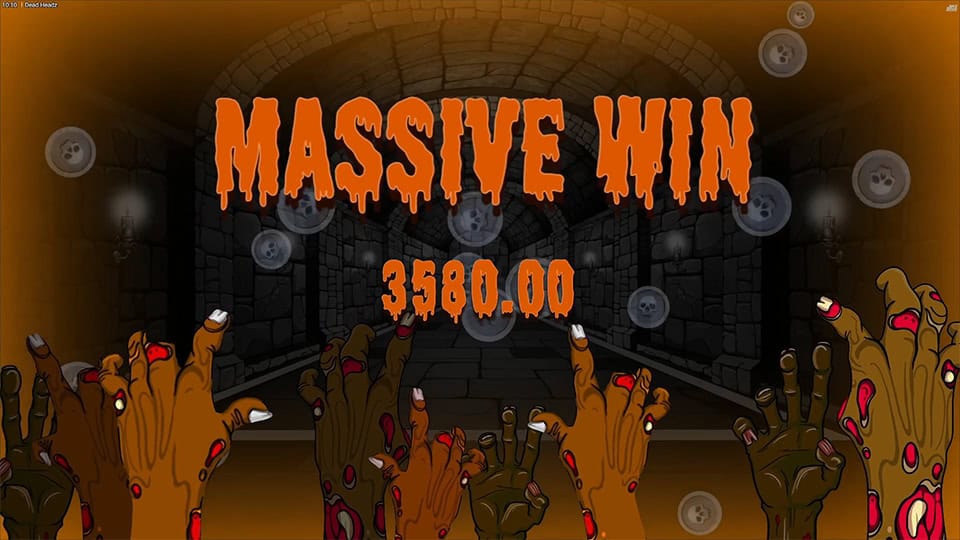 Massive Win screen in Dead Headz with dripping orange letters and zombie hands reaching upward in celebration.
