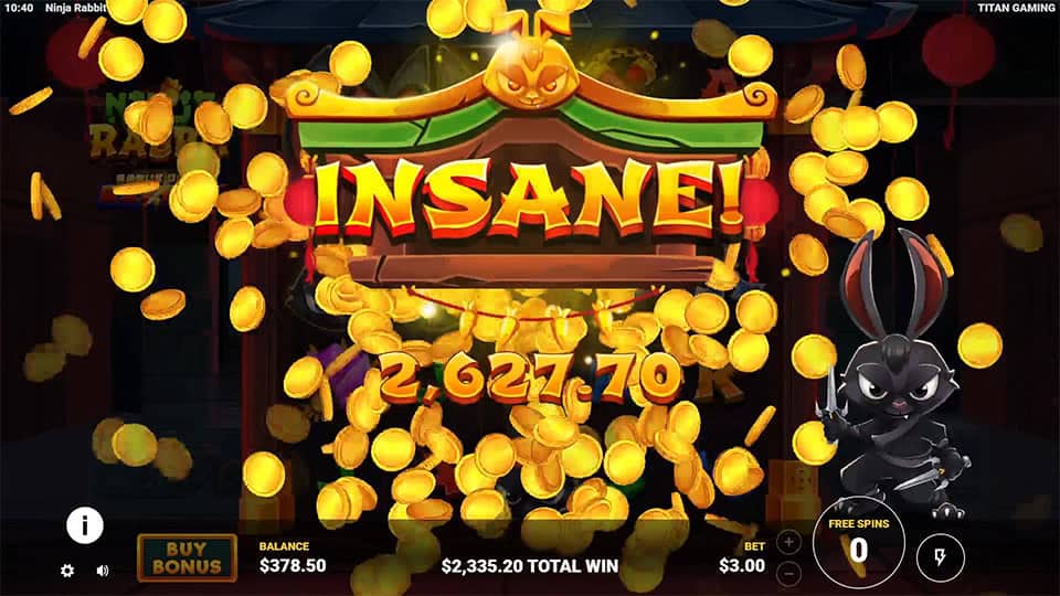 Insane win banner with gold coins flying and Ninja Rabbit on the right.