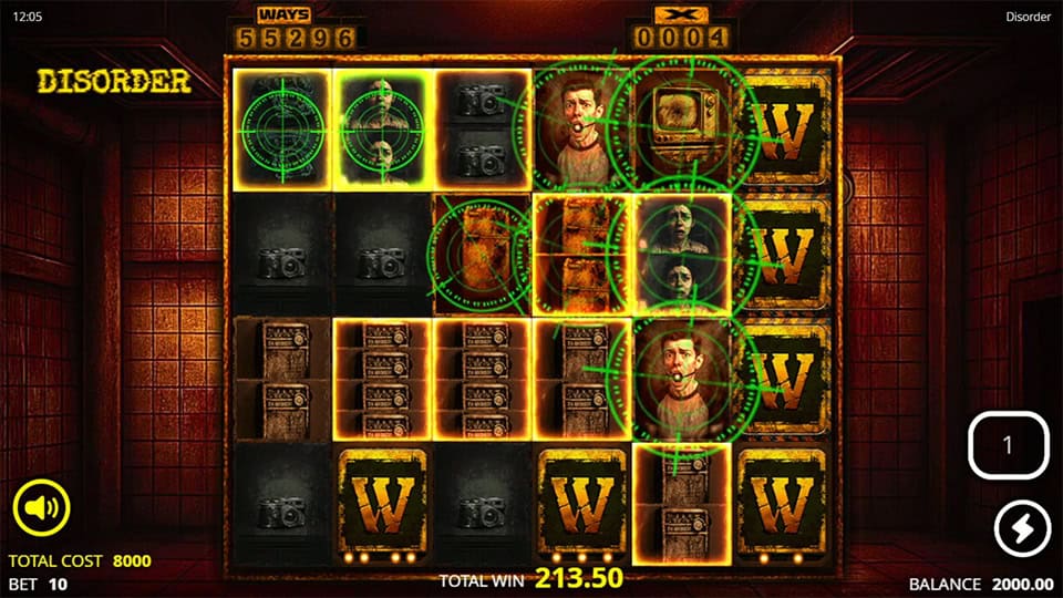 Disorder slot bonus round with glowing green bomb symbols, wilds, and chaotic grid setup in a red-lit asylum room.